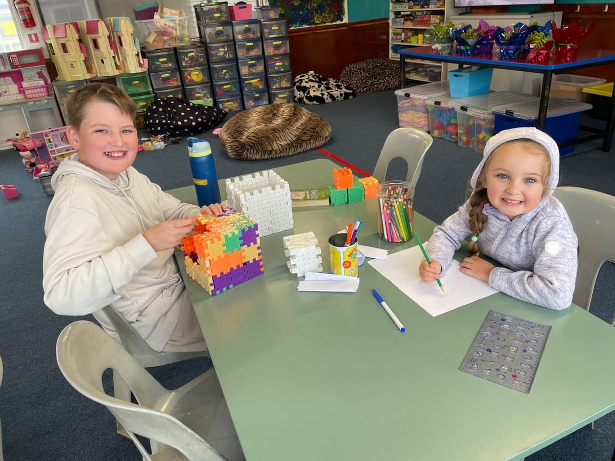 Children building with blocks and drawing at KidsKnection