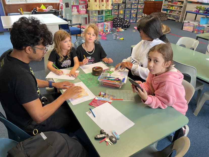 Staff helping children with arts and crafts activities